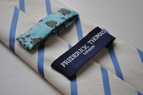 ivory tie with blue club stripes